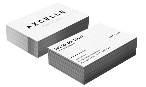 two stacks of minimalistic white business cards for a company